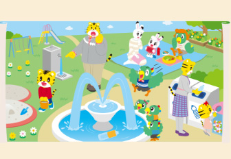 しまじろうの家族たちが噴水のある緑の公園にいる